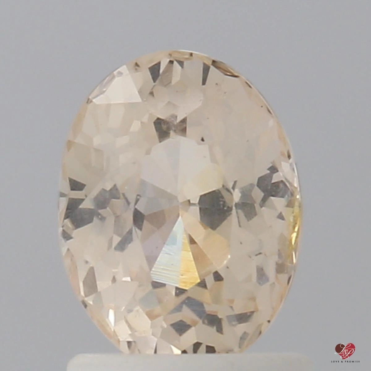 1.54cts Oval Honey Apricot Sapphire