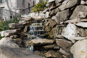 Photo- Stairway and man made waterfall at the River Walk, also known as the Passeo del Rio, a network of walkways along the banks of the San Antonio River 2 Fine Art Photo 36in x 24in