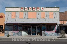 Photo- This old vaudeville house, built in the 1930s in Alpine, Texas, was purchased by Indian immigrant Avanish Rangra, a chemistry professor at Sul Ross State University locally 36in x 24in